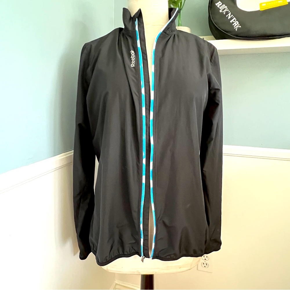 Reebok- Very light rain jacket with mesh liner and inside pocket - new condition